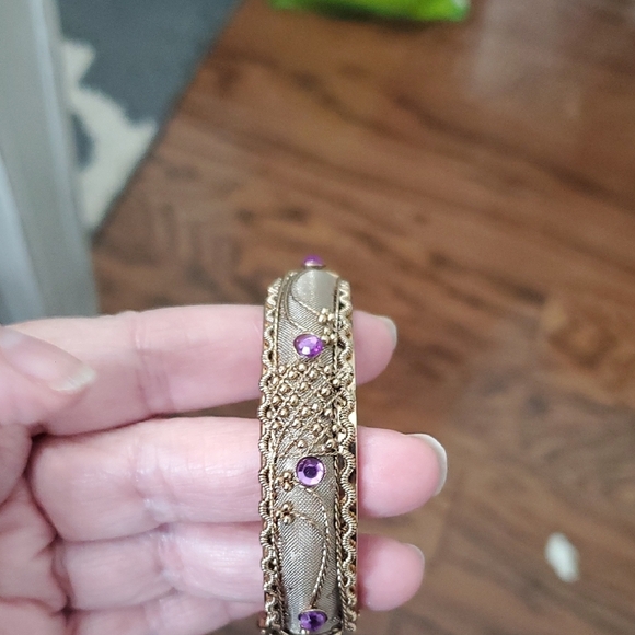 Gold tone Intricate bracelet w/ raised pattern with amethyst cor stones on Hinge - Picture 3 of 5
